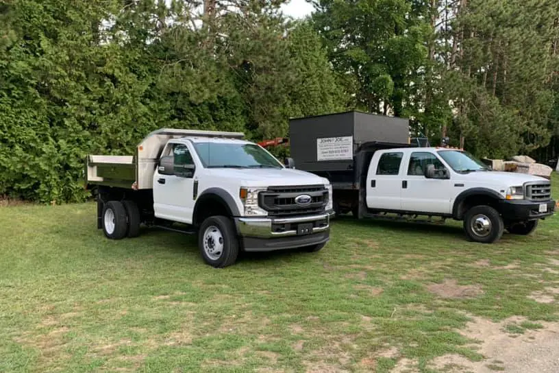 two white work trucks